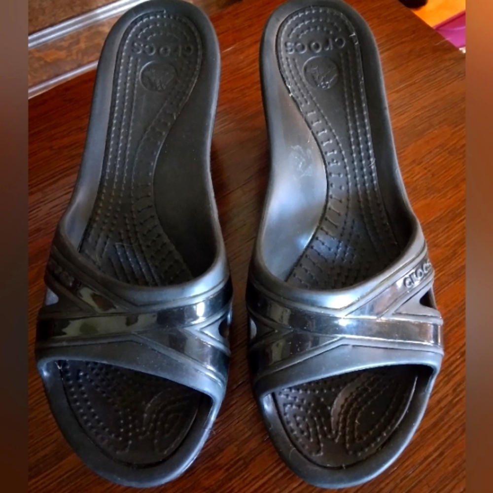 Crocs black wedge heel shoes.